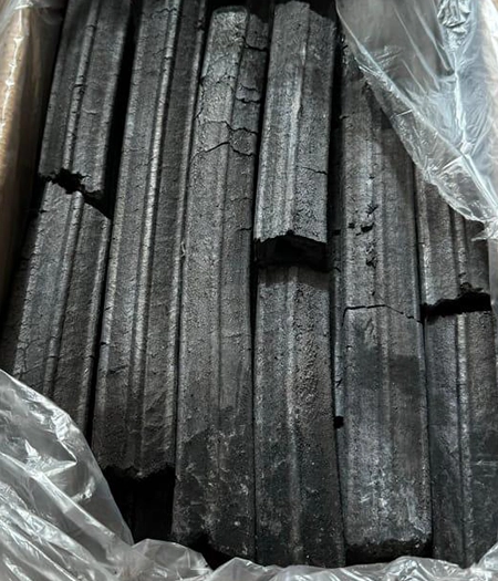 High-quality elongated charcoal sticks packed for efficient and long-lasting burns in commercial or personal use.