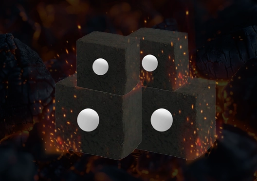 Charcoal cubes with white circular indentations, surrounded by fiery sparks, designed for long-lasting and efficient burning.